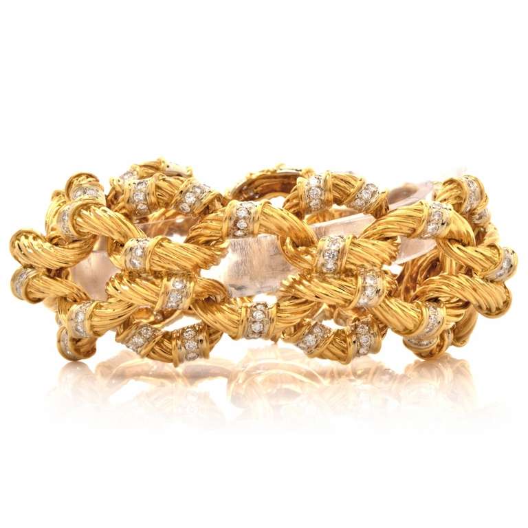 This Estate bracelet of conspicuous and elegant  aesthetic is crafted in  solid 18K yellow gold, weighing approximately 148.2 grams and measuring approximately 8