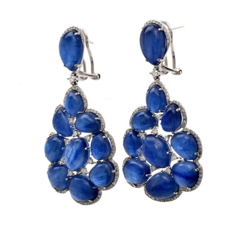 These pendant earrings with blue kyanite cabochons and diamonds are crafted in solid 18K white gold, weighing approx. 19.9 grams and measuring approx. 2
