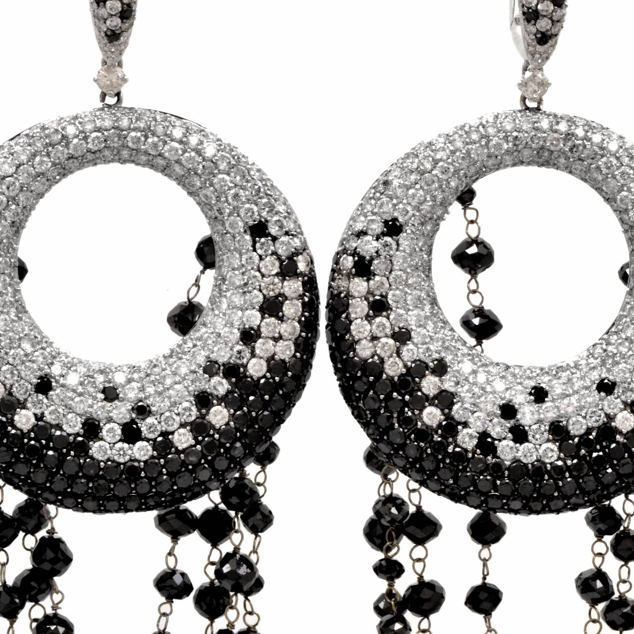 These conspicuous  fancy earrings with pave-set black and colorless diamonds  crafted in solid 18K white gold, weighing 32.1 grams and measuring 4