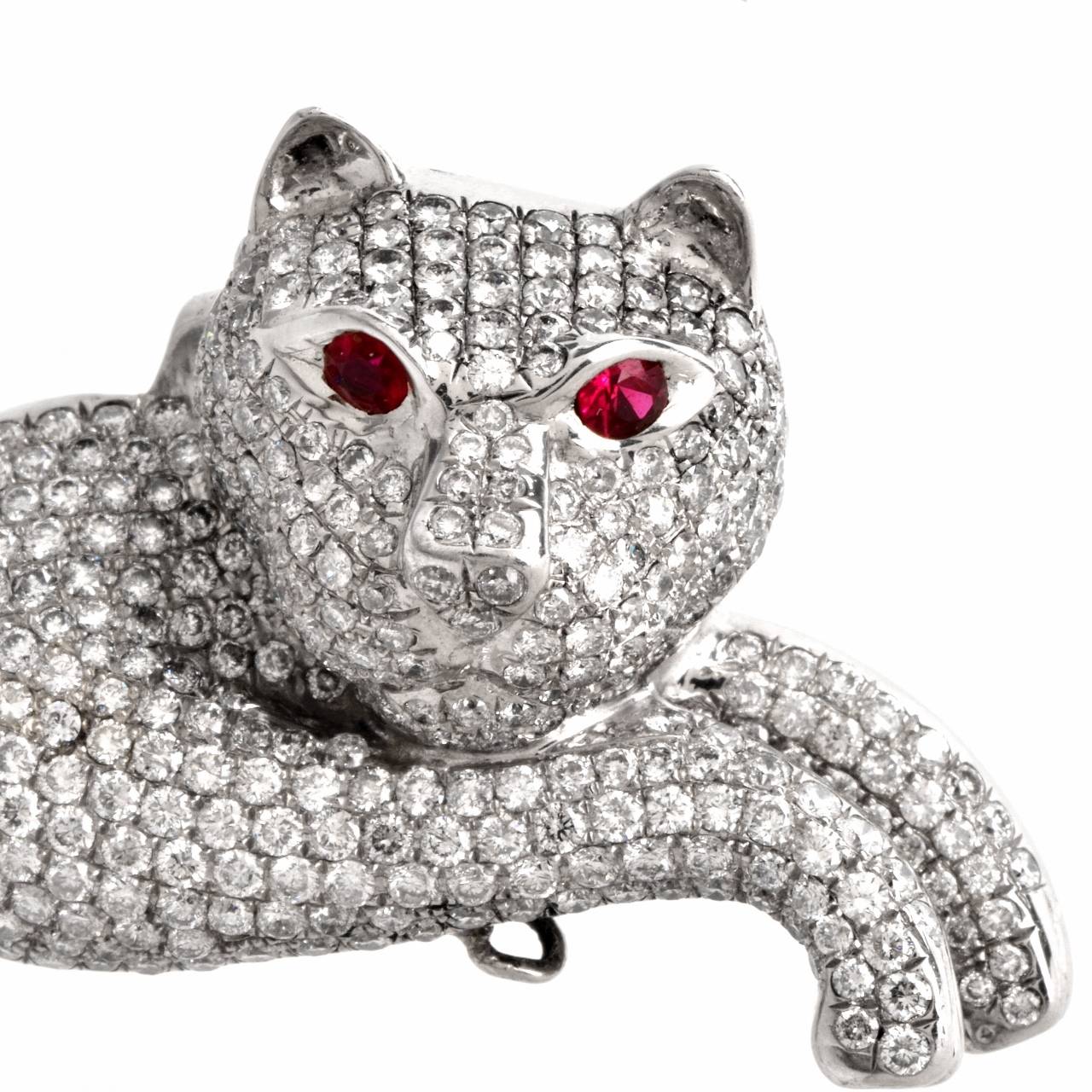 This captivating estate lapel brooch resplendent in  pave diamonds is crafted in solid 18K white gold, weighs approx. 40.1 grams and  measures 2.5