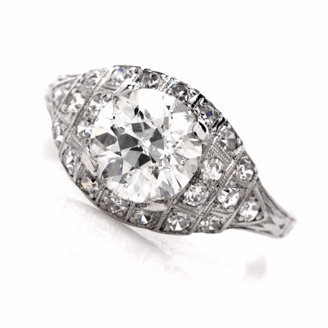 This authentic vintage engagement ring of immaculate design and alluring monochromatic aesthetic is crafted in solid platinum, weighs approx. 3.1 grams. Designed as an alluring convex marquise shape  plaque, this exquisite engagement ring exposes at