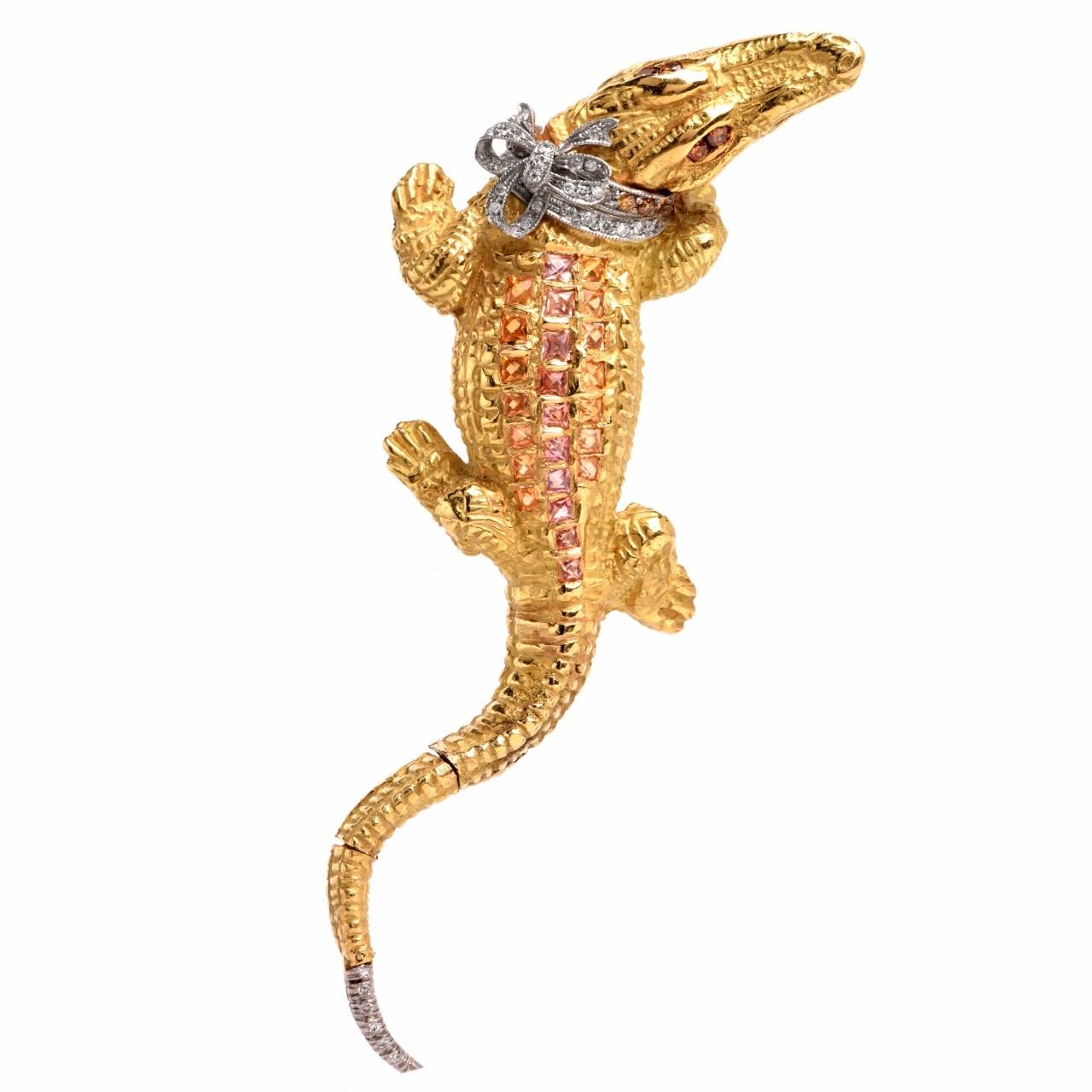 his vintage Retro  lapel brooch of  opulent aesthetic is of Italian provenance, handcrafted and signed by Capello Jewelers of Torino, Italy. It is crafted in solid 18K yellow gold, weighing 68.6 grams and depicts the artfully designed  sculptured