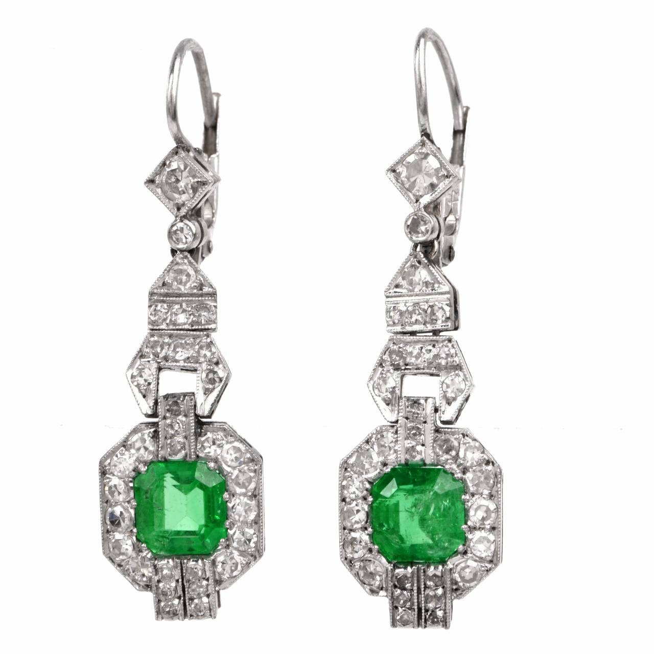 These alluringly beautiful Art Deco earrings of unmatched refinement and aesthetic appeal are crafted in solid platinum and weigh approx. 5.8 grams. Quintessentially Art Deco in their geometric features, these graceful earrings are composed of
