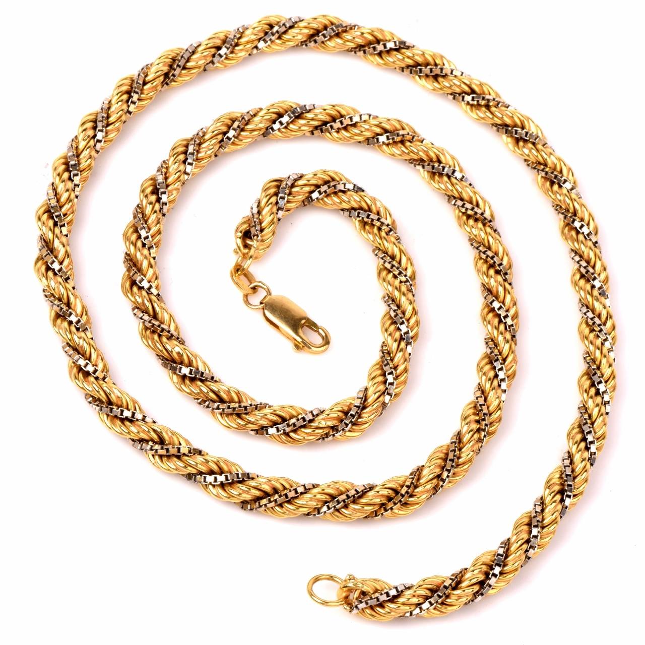 This vintage retro chain of Italian workmanship incorporates a combination of twisted rope design yellow gold, interwoven with a thin white gold chain of rectangular 'box' design links. The chain measures 20