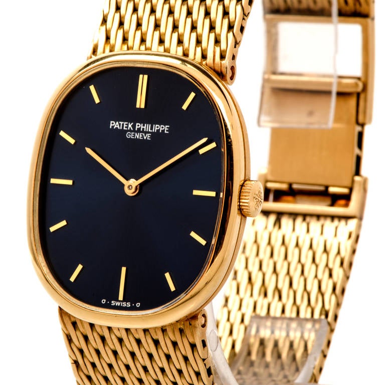 Patek Philippe 18k yellow gold ellipse wristwatch, Ref. 3548, with integral yellow gold mesh bracelet, weighs approx. 82.6 grams. The entire watch including the clasps measures approx. 19.5 cm (7.8