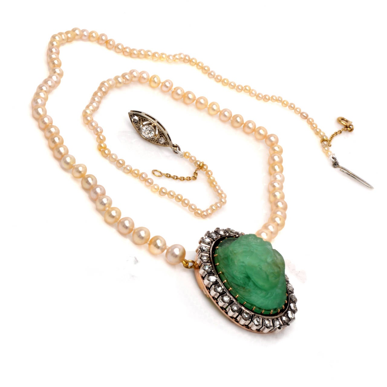 This authentic antique necklace with natural salt water pearls, an immaculately carved angel emerald cameo and antique rose-cut diamonds is of French provenance, bearing the official French hallmark and is crafted in a combination of  18K rose gold