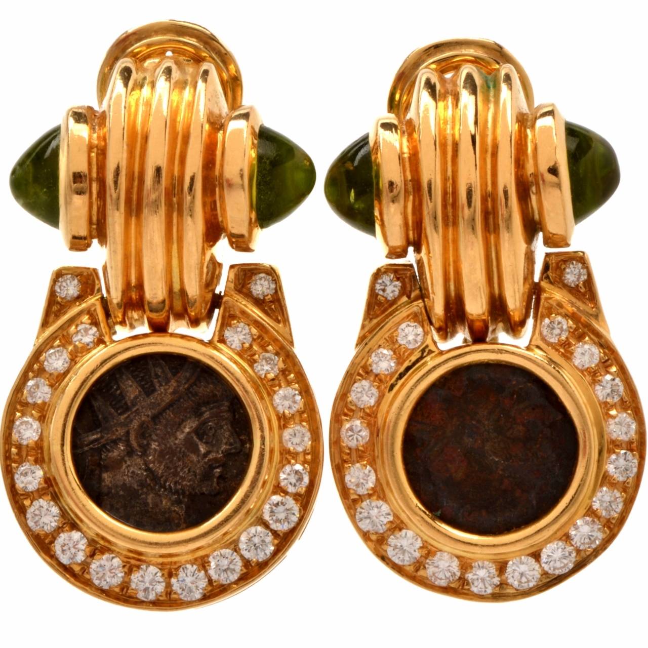 These earrings of creative style are crafted in solid 18K gold and weigh approx. 29.8 grams.  The earrings incorporate orbicular profiles centered with antique Roman coins, surrounded by  diamond borders, surmounted by immaculately ridged,