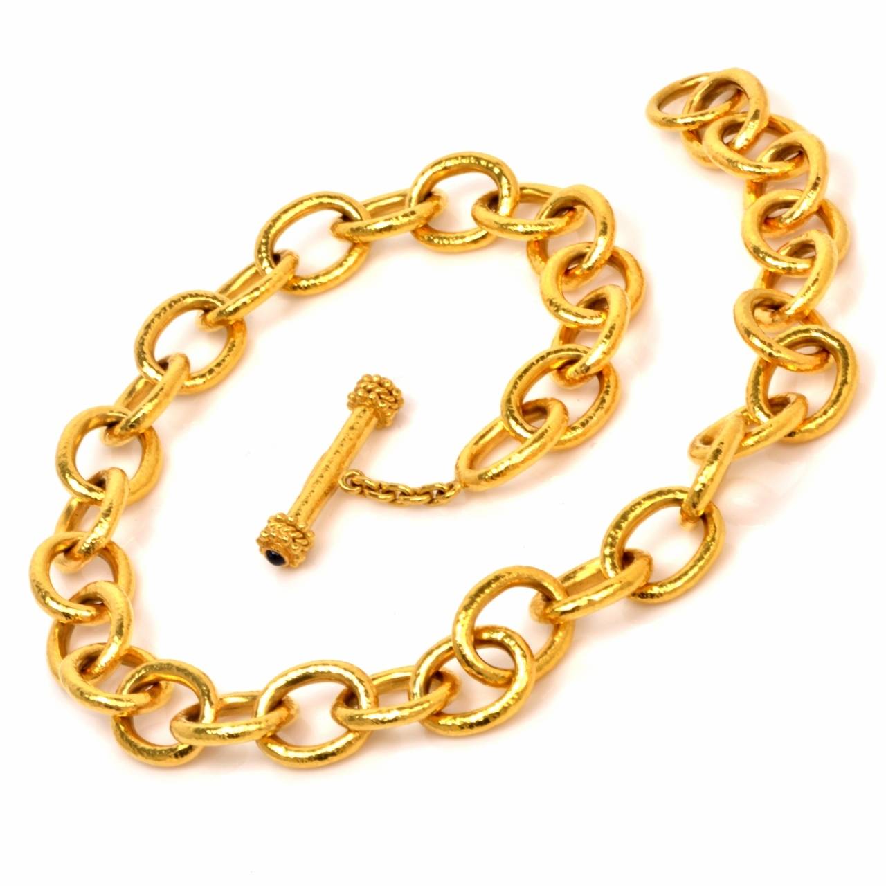 This impressive chain necklace designed by Elizabeth Locke is an authentic piece bearing the designer's hallmark, and is crafted in solid 19K yellow gold. It weighs approximately 98.3  grams and measures approx. 16.5