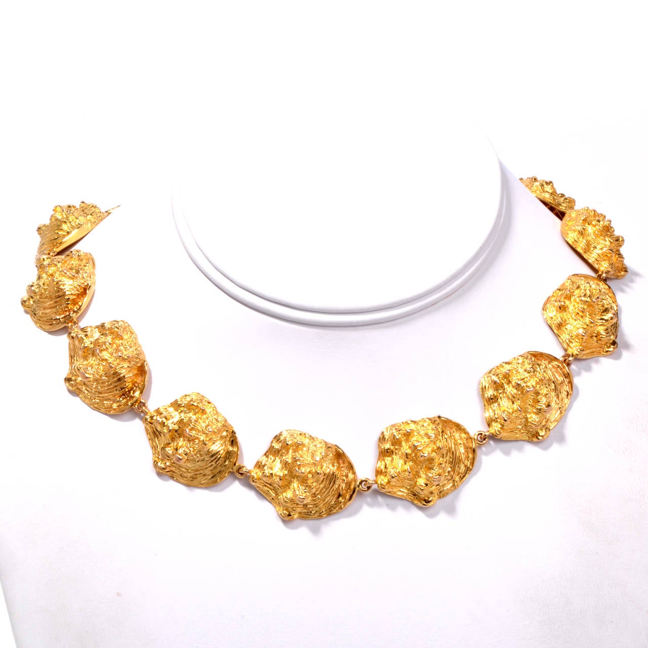 Fourteen realistic cast oyster gold shells are linked to form this weighty gold necklace from noted Beverly Hills jeweler to the stars, William Ruser. Loretta Young was among his earliest clients followed by Joan Crawford and many other leading