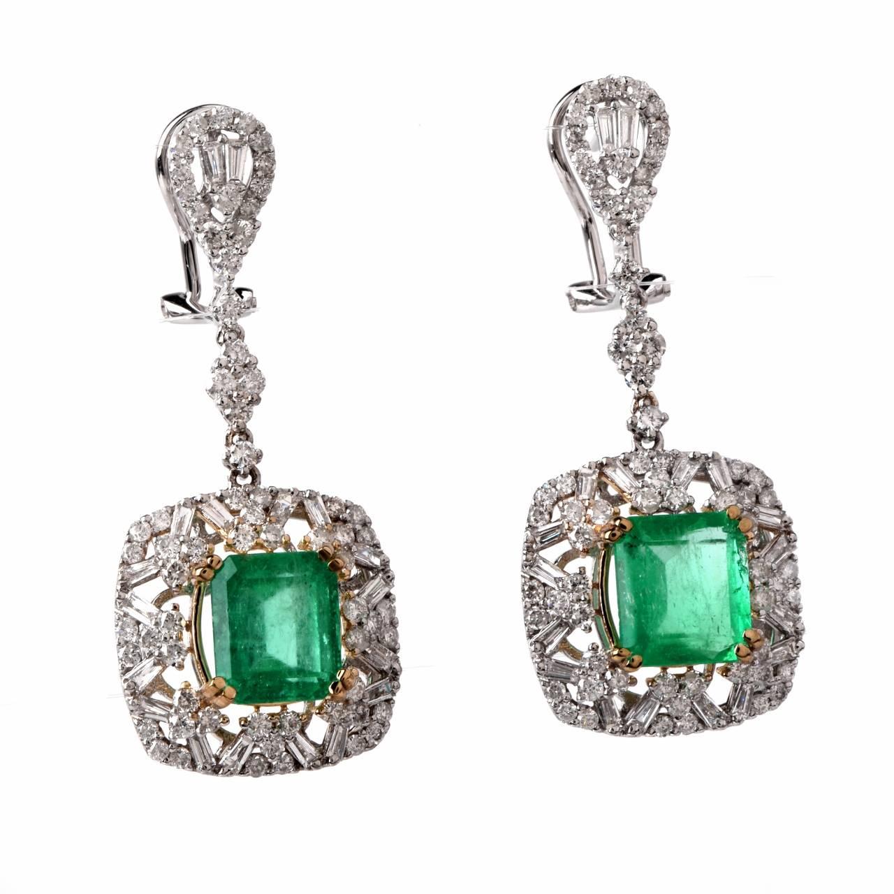 These  Art Deco style earrings with a pair of emerald-cut emeralds, tapered baguettes and round-faceted diamonds are handcrafted in solid 18K white gold with a touch of yellow gold applied to the emerald settings. They are centered with emerald-cut