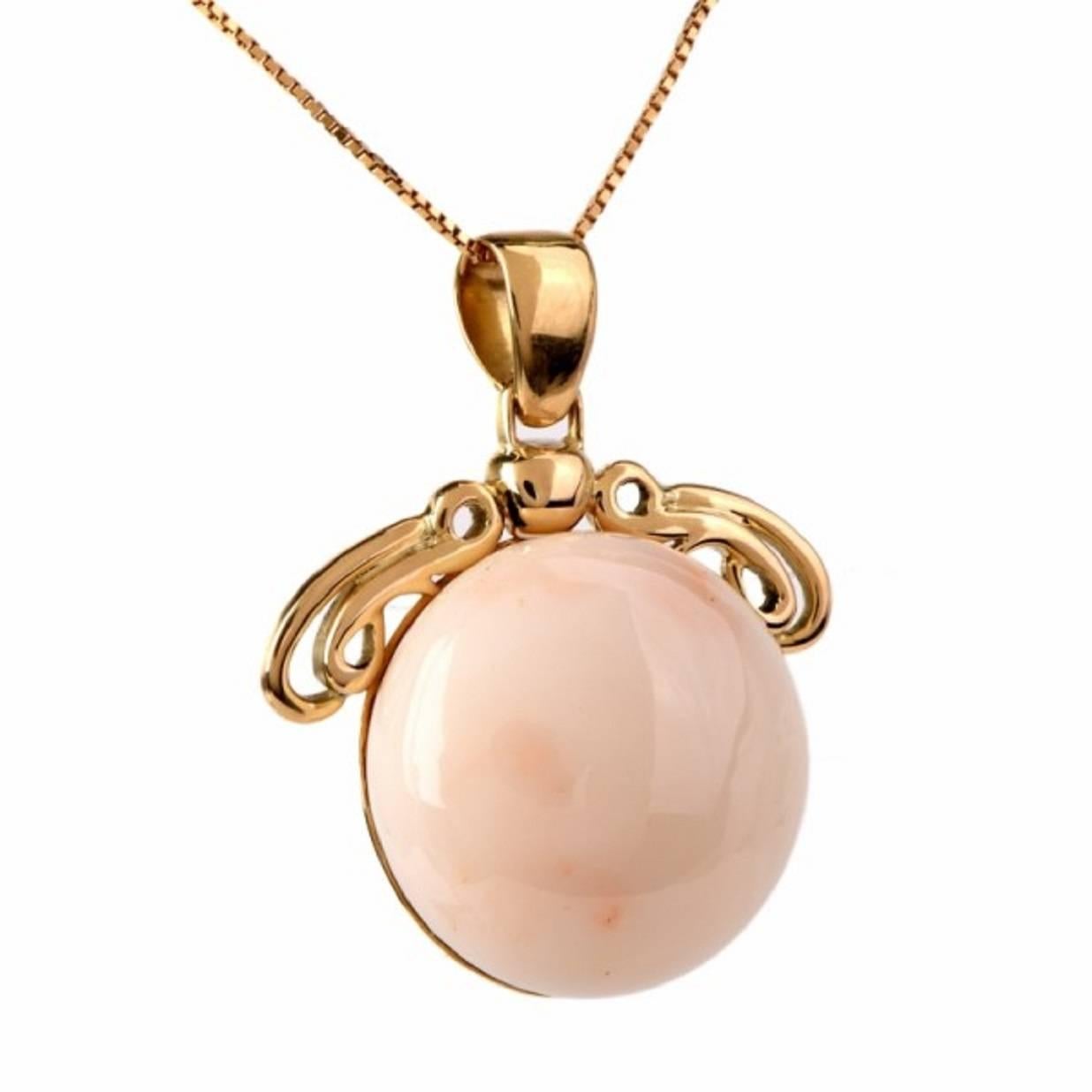 This  vintage  coral  pendant  is handcrafted in 18K yellow gold, weighs 20.3  grams  and measures 40  mm long (inclusive of bale) and 33  mm wide. This classically enchanting  vintage pendant incorporates  a natural pastel  soft  creamy-white