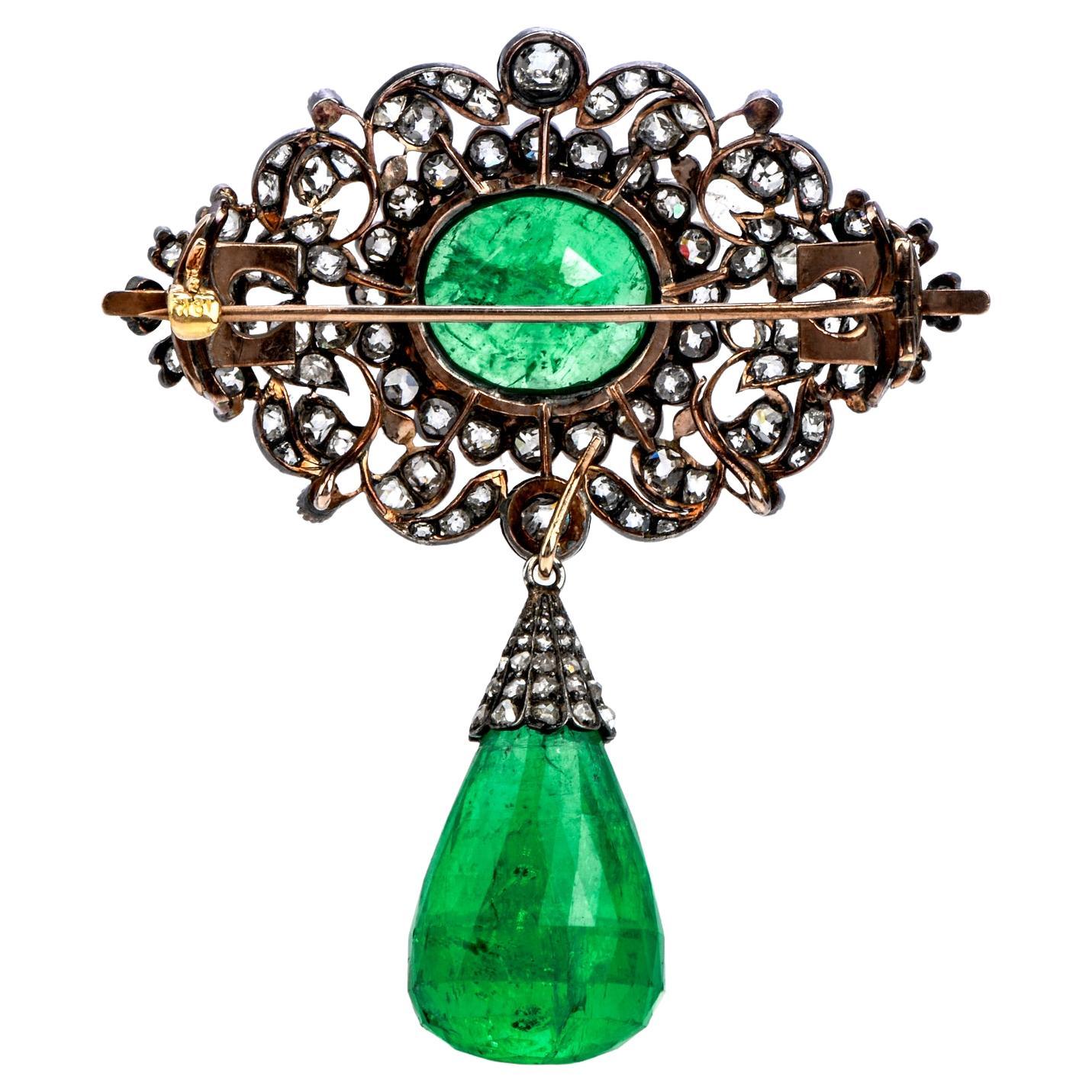 his antique Georgian Emerald Diamond Silver and Gold pendant is masterfully crafted in silver and gold, weighing 17.6 grams and measuring 47mm wide and 57 mm long.

This stunning and rare antique pendant is centered with a large oval-shaped genuine