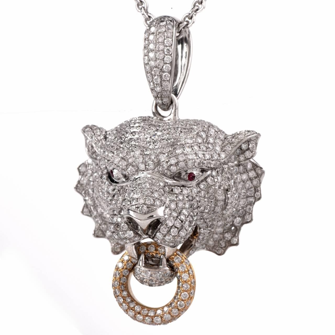 This  Diamond pendant is crafted in solid 18K white gold, weighing approx: 19.6 grams and measuring approx: 45mm x 30mm x 19.5mm.  This completely diamond embellished tiger's head has not spared one detail.  The eyes shine with 2 genuine red rubies