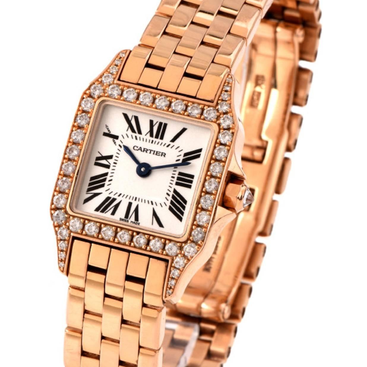 This Santos Demoiselle watch, quartz movement in mint condition. 18K pink (rose) gold case set with 48 brilliant-cut diamonds and 8-sided crown set with a brilliant-cut diamond, totaling 0.37 carats. Silver-grained dial. Blued-steel sword-shaped