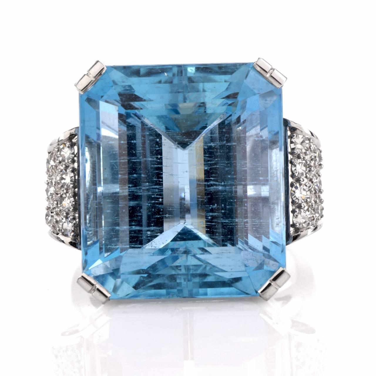 This stunning vintage ring circa 1950's is the perfect pop of color for any ensemble, a chic and stylish ring to own! Finely crafted in platinum, this ring features 1 genuine emerald cut fine Great blue aquamarine approx. 23.44ct. The gorgeous