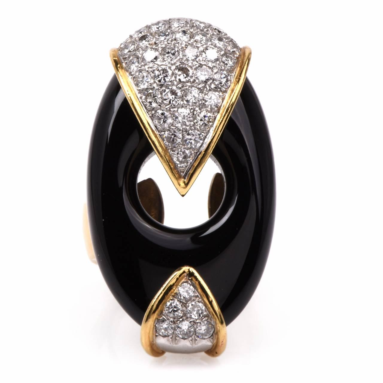 This stylish retro Italian diamond and black onyx large cocktail ring is set in 18K yellow gold, weighing approx: 24.6 grams and measuring approx: 37mm x 21mm. Embellishing the top and bottom of this antique cocktail ring is a wrap of yellow gold
