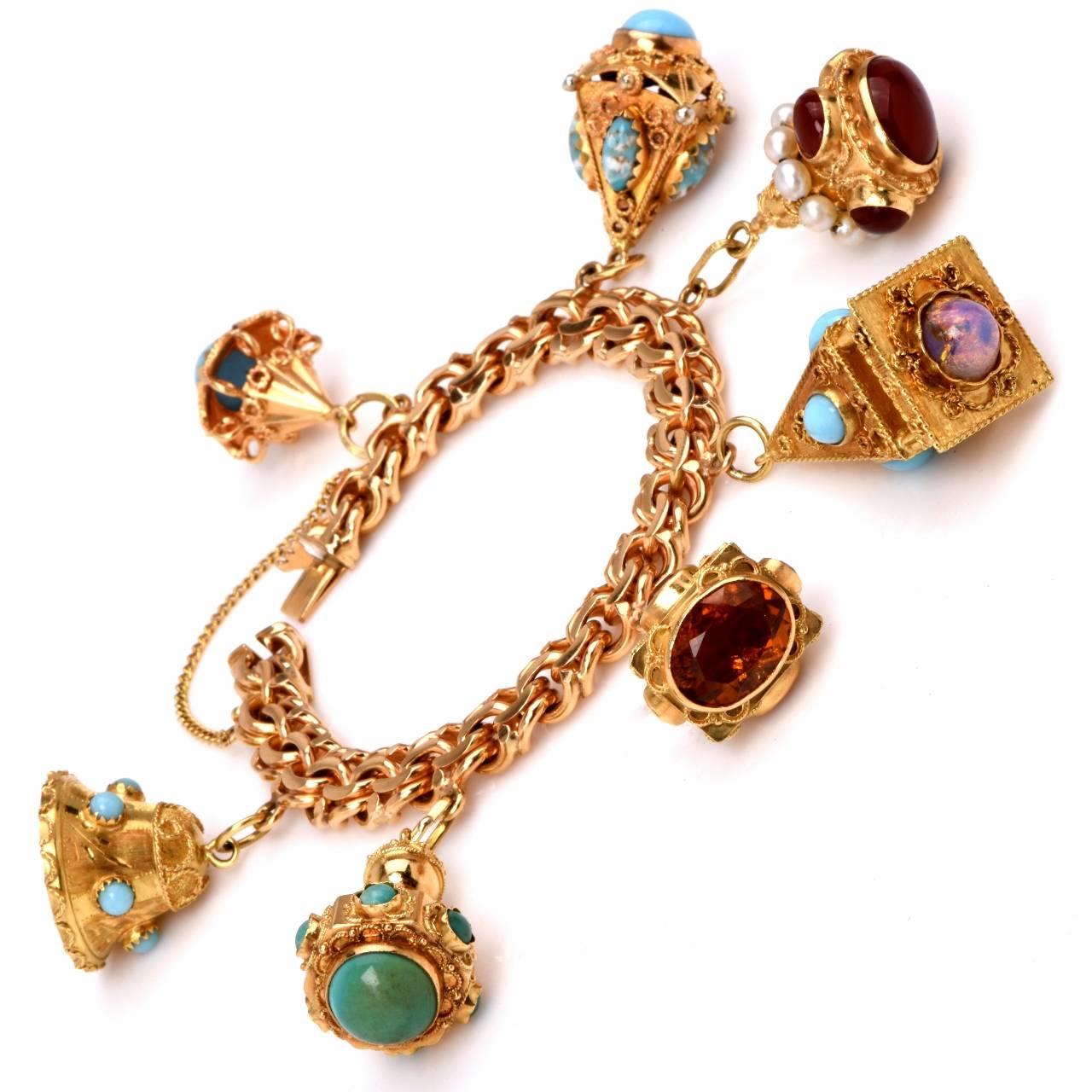 This impressive vintage multi-gem flexible chain link bracelet is handcrafted in 18K yellow gold, weighing approx: 119.7 grams and measuring approx: 6