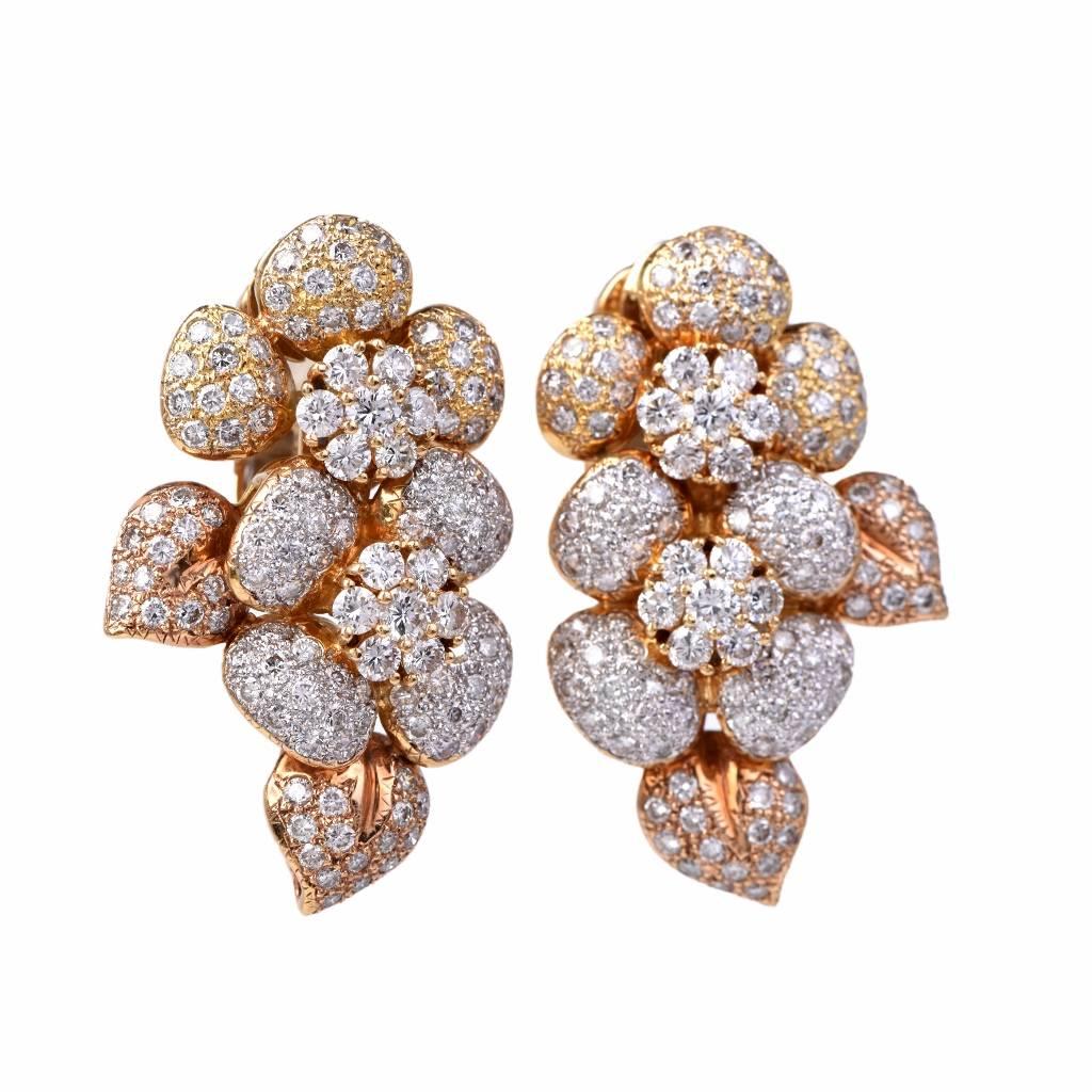 These estate diamond cluster  earrings of flexible design are crafted in  solid 18K yellow gold, weighing approx: 31.3 grams and measuring approx: 37.5mm high x 22.5mm wide. Designed in a beautiful display of leaves and flower motif completely