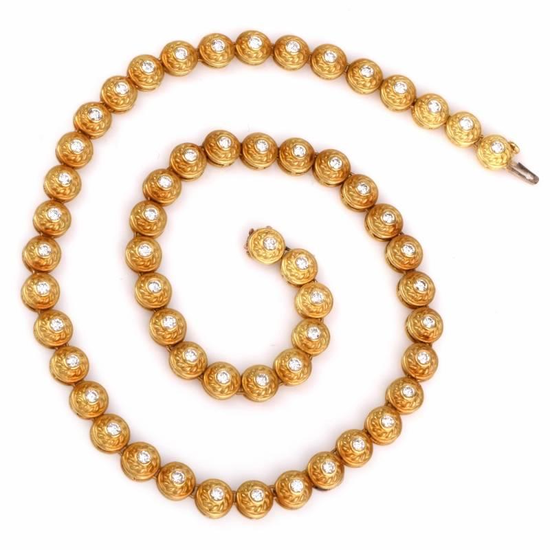 This classically elegant estate diamond necklace is crafted in solid 18K yellow gold, weighing approx: 46.0 grams and measuring approx: 15 1/2