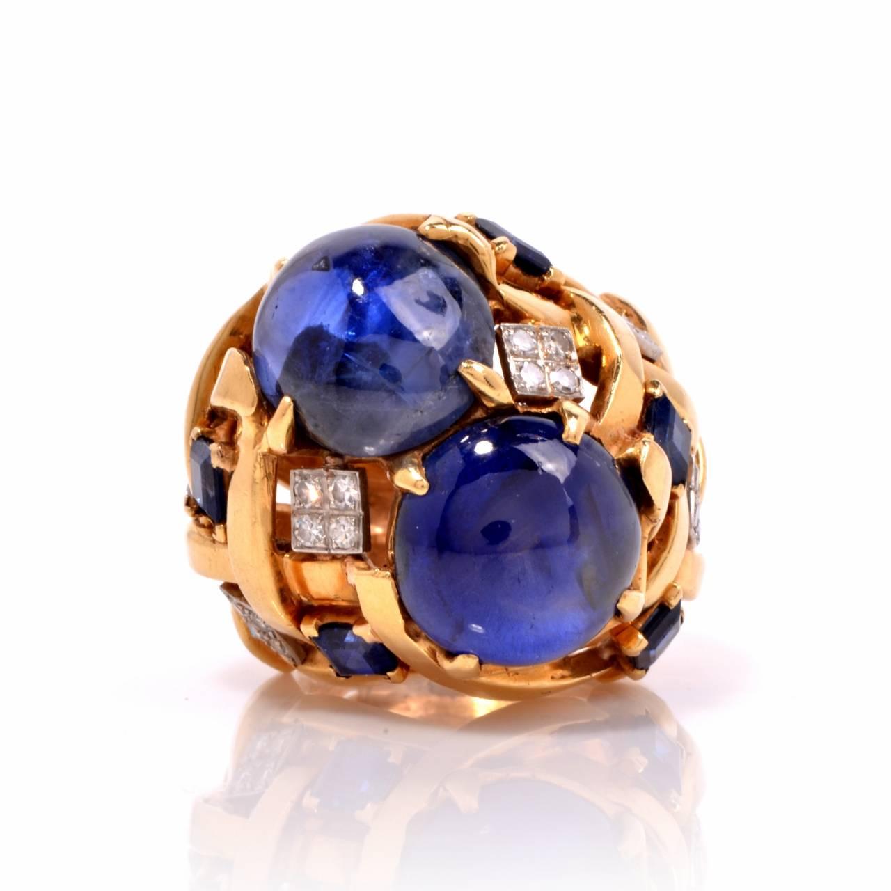 Dover Jewelry presents this glamorous estate cocktail ring, finely crafted in solid 18k yellow gold.

This ring features 2 genuine GIA Graded Report #1162697778 & #2165697786 cabochon Natural Blue Sapphires Cabochon (Sri Lanka origin), 1 weighing
