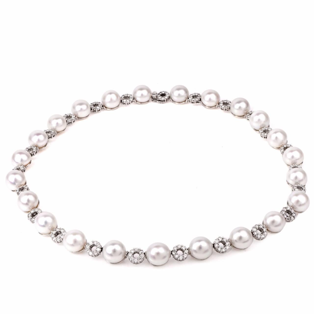 This aesthetically necklace with 23 lustrous south Sea pearls measuring 12 mm in diameter of an enchanting 'white with a pinkish hue' color is crafted in solid 18K white gold and measures 19