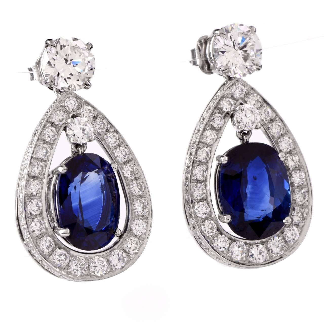 These classically sophisticated pendant earrings of unsurpassed elegance incorporate pear-shaped profiles, are crafted in solid platinum and weigh approx. 12.2 grams. They expose a pair of eye-catching GIA certified cushion-cut genuine blue