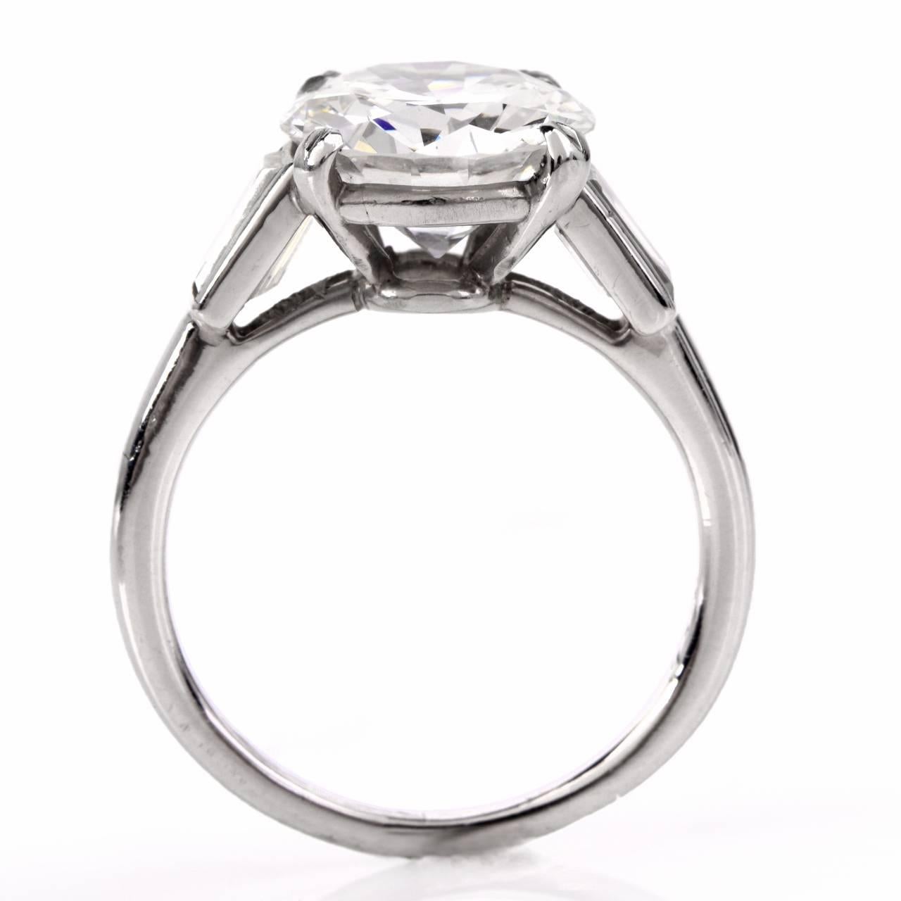 This cartier  diamond engagement solitaire ring  is crafted in solid  platinum, weighing approx: 5.0 grams with center diamond  wighing aprox. 3.21cts, GIA certified H color SI1  with an impacable brilliance.  This classic ring, set with two tapper
