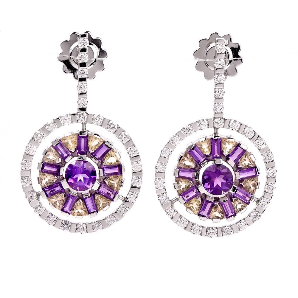 These classy and sophisticated GARAVELLI earrings are crafted in solid 18K gold. These circular drop earrings are accented with some 54 genuine round cut diamonds approx 2.50cttw, F-G color, VVS clarity, some 20 genuine amethysts and some 18 round