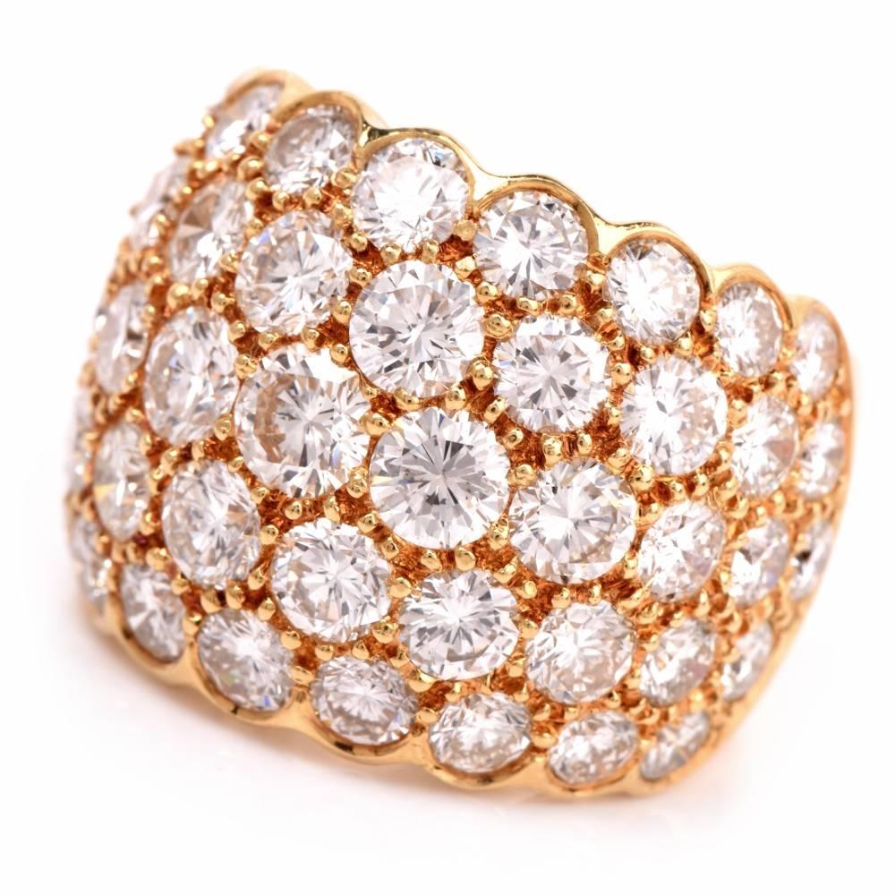 This fashionable diamond dome ring is crafted in solid 18K yellow gold, adorned with some 50 genuine graduated pave-set diamonds weighing approx. 10.20cts graded G-H color and VS1-VS2 clarity. This ring features a sturdy, wide and sizable shank with