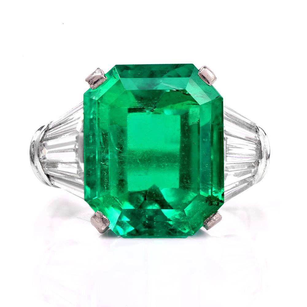 This stunning Emerald diamond ring is crafted in solid platinum. It exposes at the center an amazing high quality Colombian emerald with GIA certificate, weighing approx. 9.40cts measuring 14.1mm x 11.44mm x 8.27mm. This breathtaking emerald is