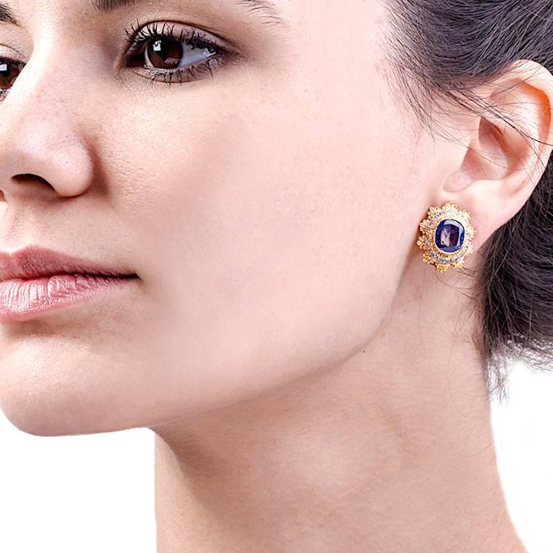 This magnificent Mario Buccellati earrings are crafted in finely textured 18K yellow gold with white gold applied to the setting. They are centered with translucent and genuine Cushion-cut faceted natural sapphires ( no heat treatment or any other)