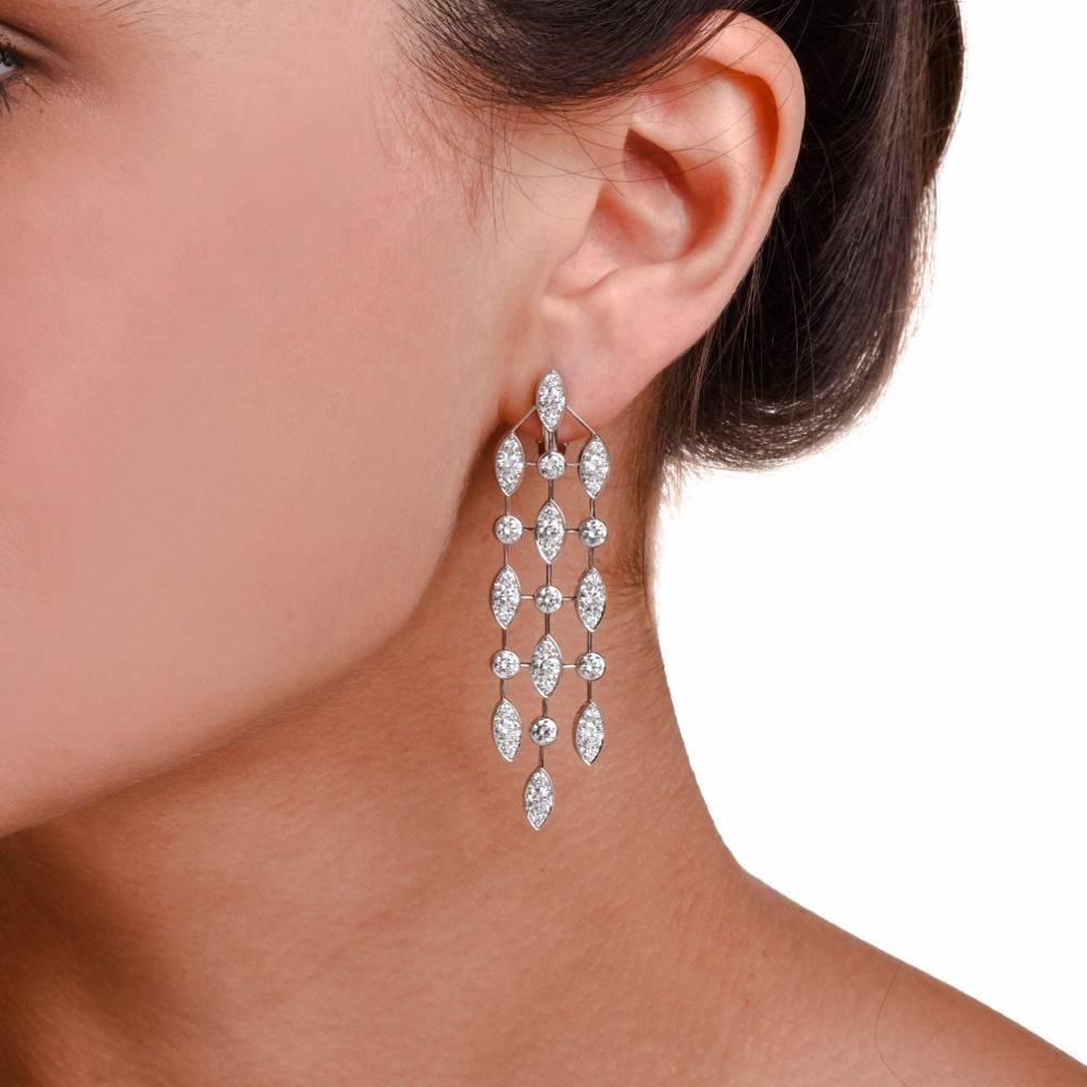 These breathtaking dangle drop authentic Cartier earrings from the  “Naiade” Collection are handcrafted in solid 18K white gold.

Displaying fine glamour, these d stunning earrings feature a 3 strand geometrical dangle drop accented with marquise