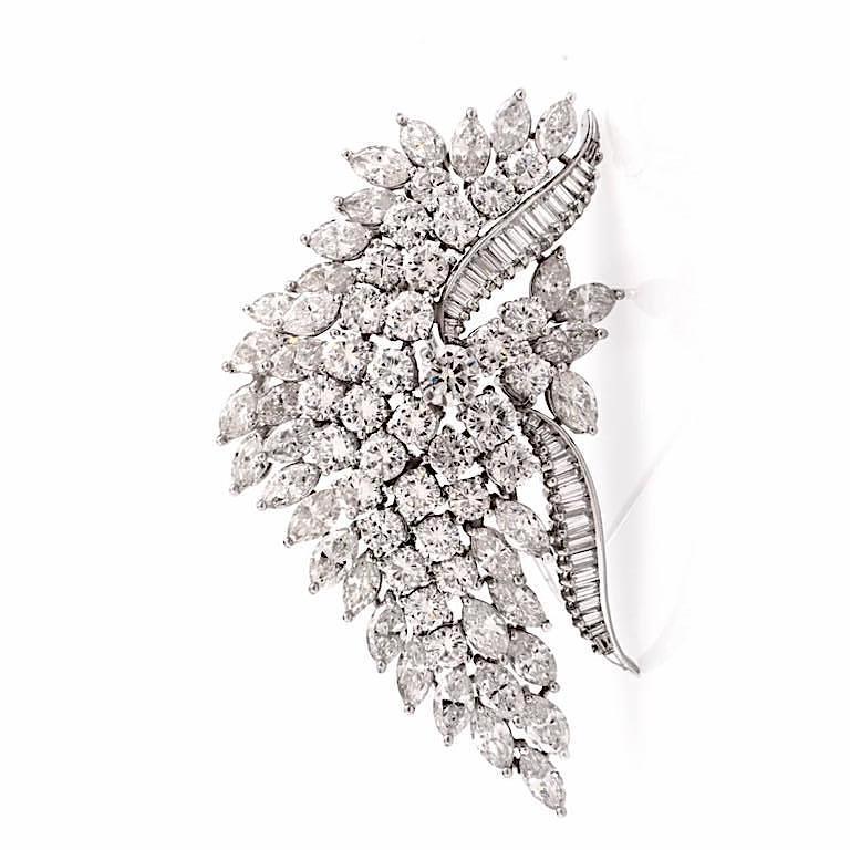 This 1960's  brooch pin  is crafted in solid platinum by famouse designer Van Clief. Pin. It weighs approx. 28.4 grams and measures 60mm x 32mm. This diamond leaf is covered with approx. 36 marquise diamonds, 30 baguette diamonds and 32