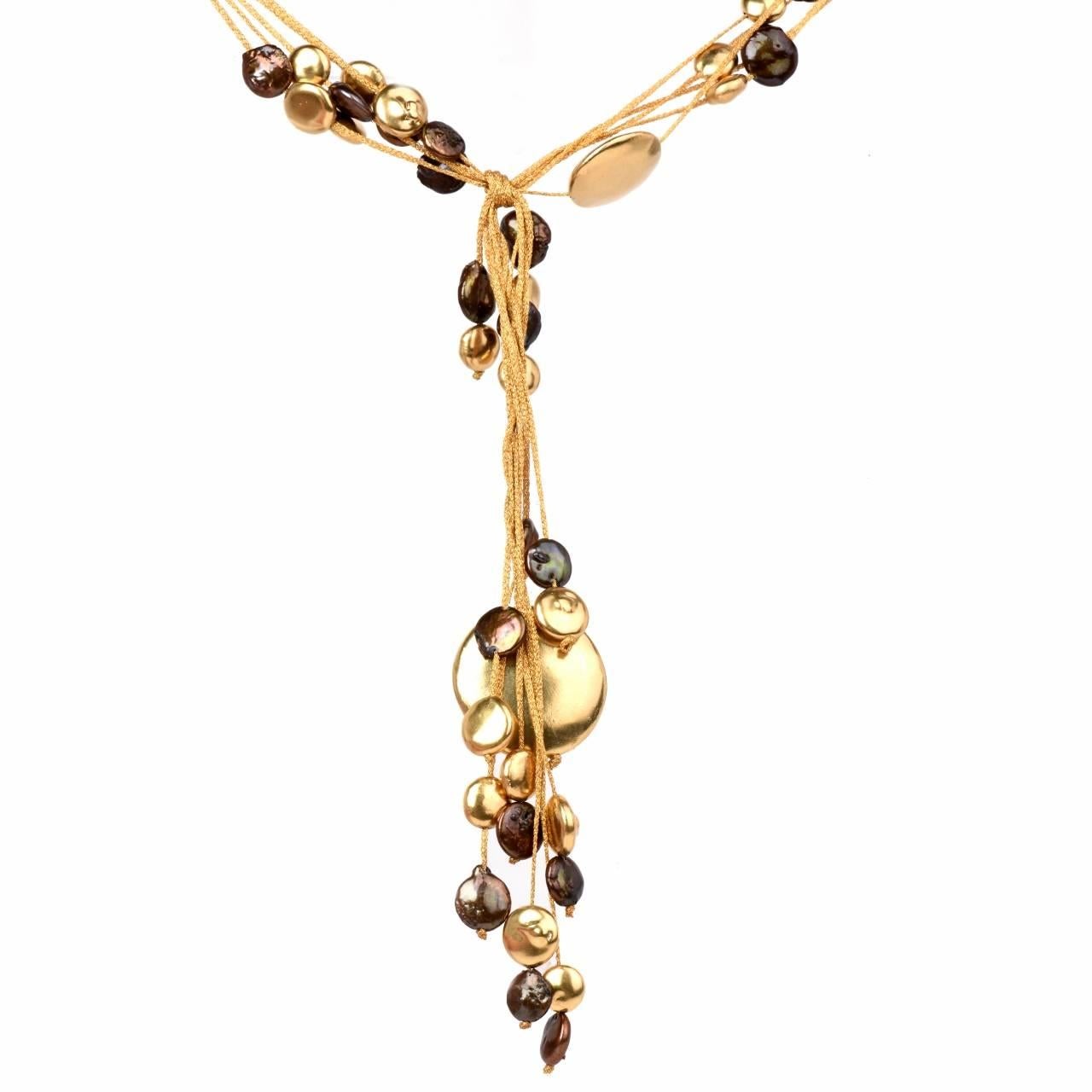 This dazzling  Italian 18K yellow gold drop necklace by designer 'Calgaro.' Featuring various solid 18k yellow gold mesh strands that are adorned with some  genuine very high lustrous  greenish golden brown  genuine pearls and  yellow genuine 18k