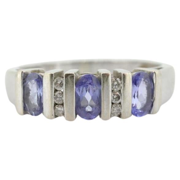 14k Tanzanite Oval and Diamond Channel Anniversary ring. Channel set eternity For Sale