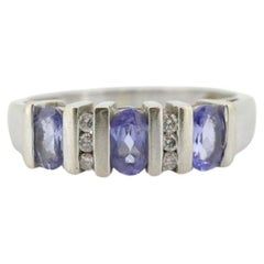 14k Tanzanite Oval and Diamond Channel Anniversary ring. Channel set eternity