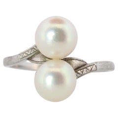 Mikimoto Pearl Ring. Sterling Silver Mikimoto Sapphire Twin Pearl Bypass band.