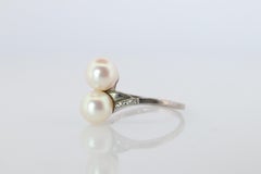 Mikimoto Pearl Ring. Sterling Silver Mikimoto Sapphire Twin Pearl Bypass band.