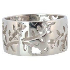 Mikimoto Wide Band. Platinum Mikimoto Intricate Floral Negative Stamped ring.
