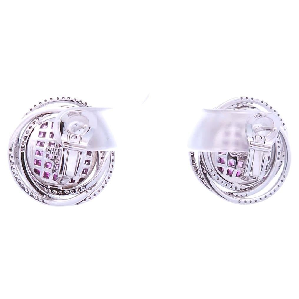 Quality, at the right price.

These designer clip-on Saturn earrings feature a total carat weight 6.66 white to pink sapphires in an invisible setting. These earrings also have 1.04 carats of round diamonds featured along the Saturn’s rings. This