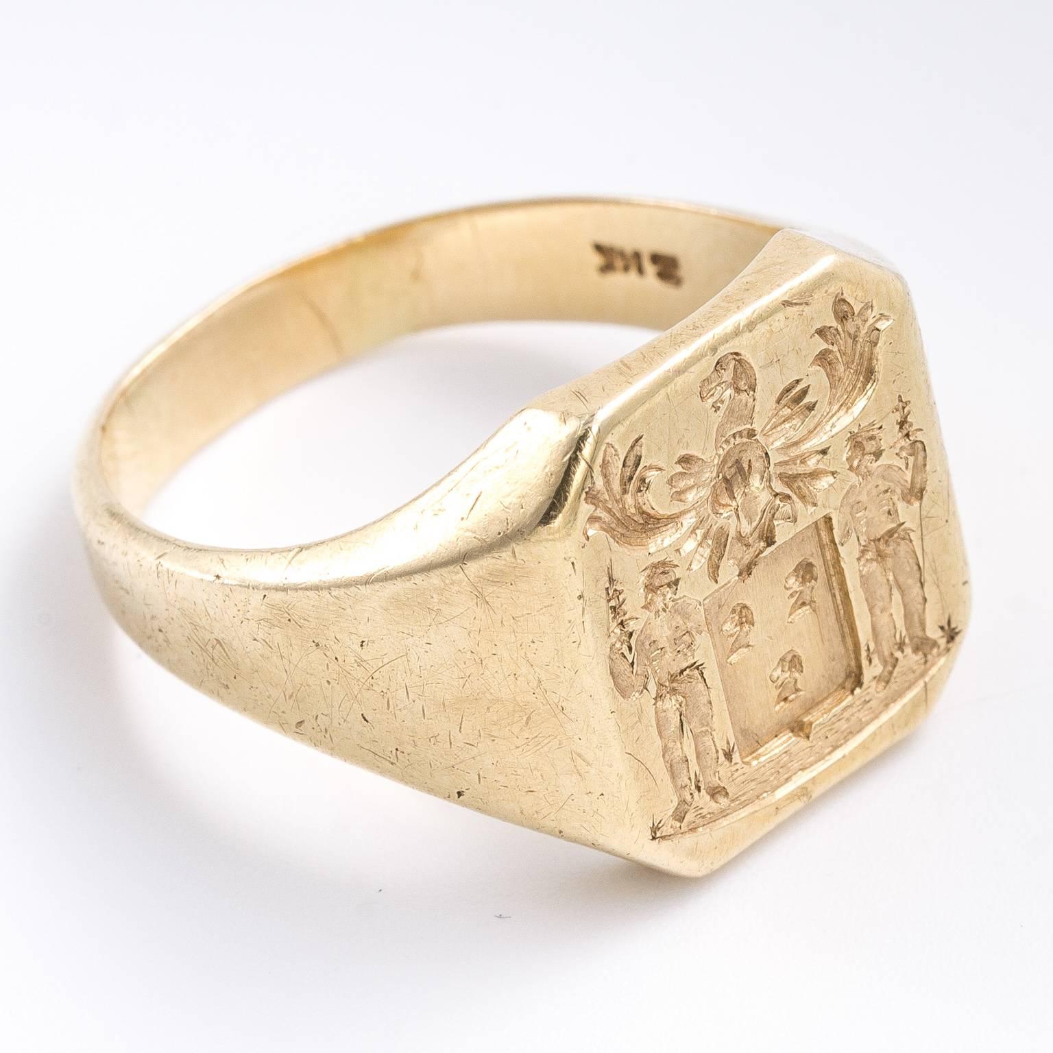 Antique 14kt signet ring with a hallmark from the United Kingdom. The intaglio of a family crest is beautifully carved. The square shape from this period is sought after. Size 10 and 12.80 grams. Signet Dimensions: 2.00 cm x 1.50 cm