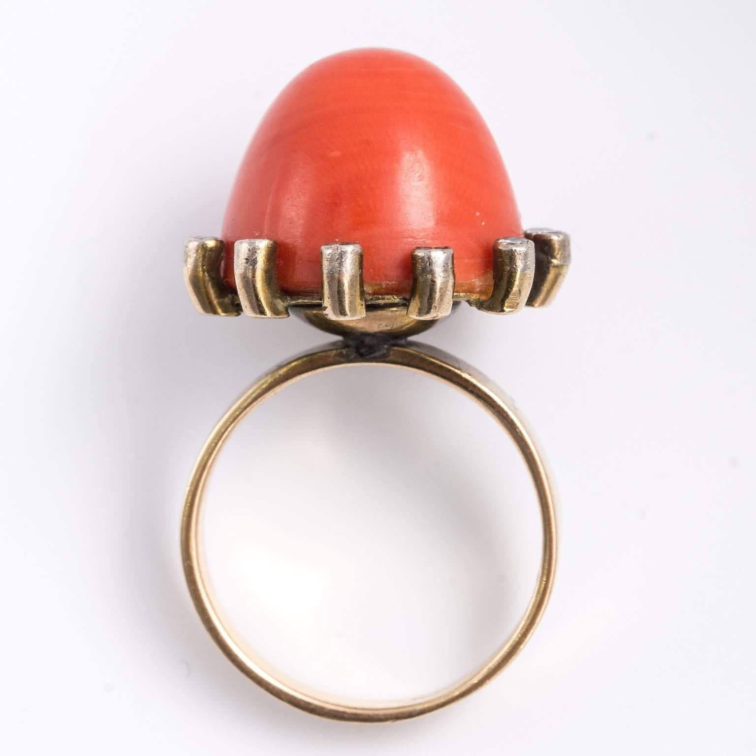 Elegant Edwardian natural coral and rose diamonds ring. A rare dome shaped perfect coral sits among sparkling diamonds in 18kt gold bezels. Unusual and flawless. Weighs 10.80 grams.