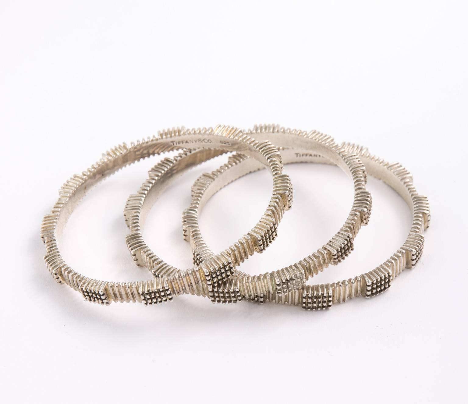 Set of three Modernist style, sterling silver Tiffany bangles ( no longer made). Sterling Silver, 925 Made in Italy.
PERIOD:1960-1980
STYLES:Mid-Century Modern
MATERIALS:Silver
