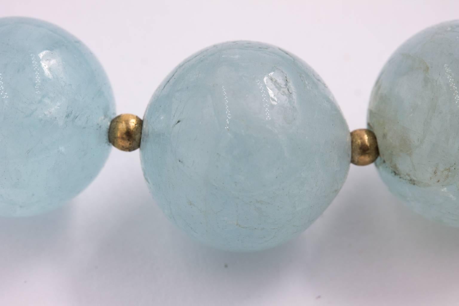 This is a beautiful necklace made from 14 mm natural aquamarine beads. 17 inches long closed with 14K yellow gold toggle clasp. There are 2 mm 14K gold beads in between the aquamarine beads.
PERIOD:1980s-Present
MATERIALS:Gold

