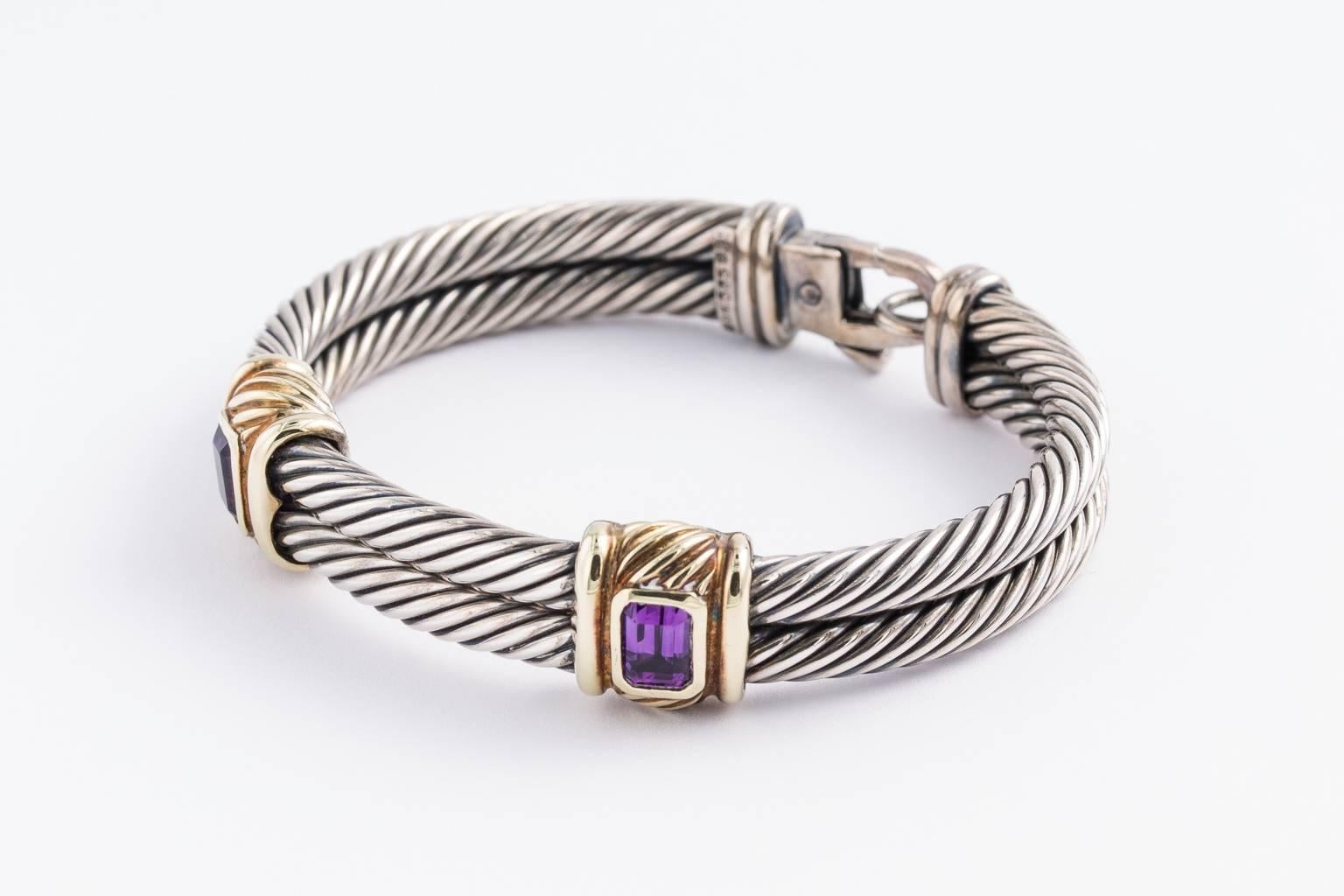 David Yurman sterling silver and heavy 14k gold trim-double cables 2 square cut amethyst-trim with gold-bracelet.
PERIOD:1980s-Present
STYLES:Contemporary
MATERIALS:Gold
