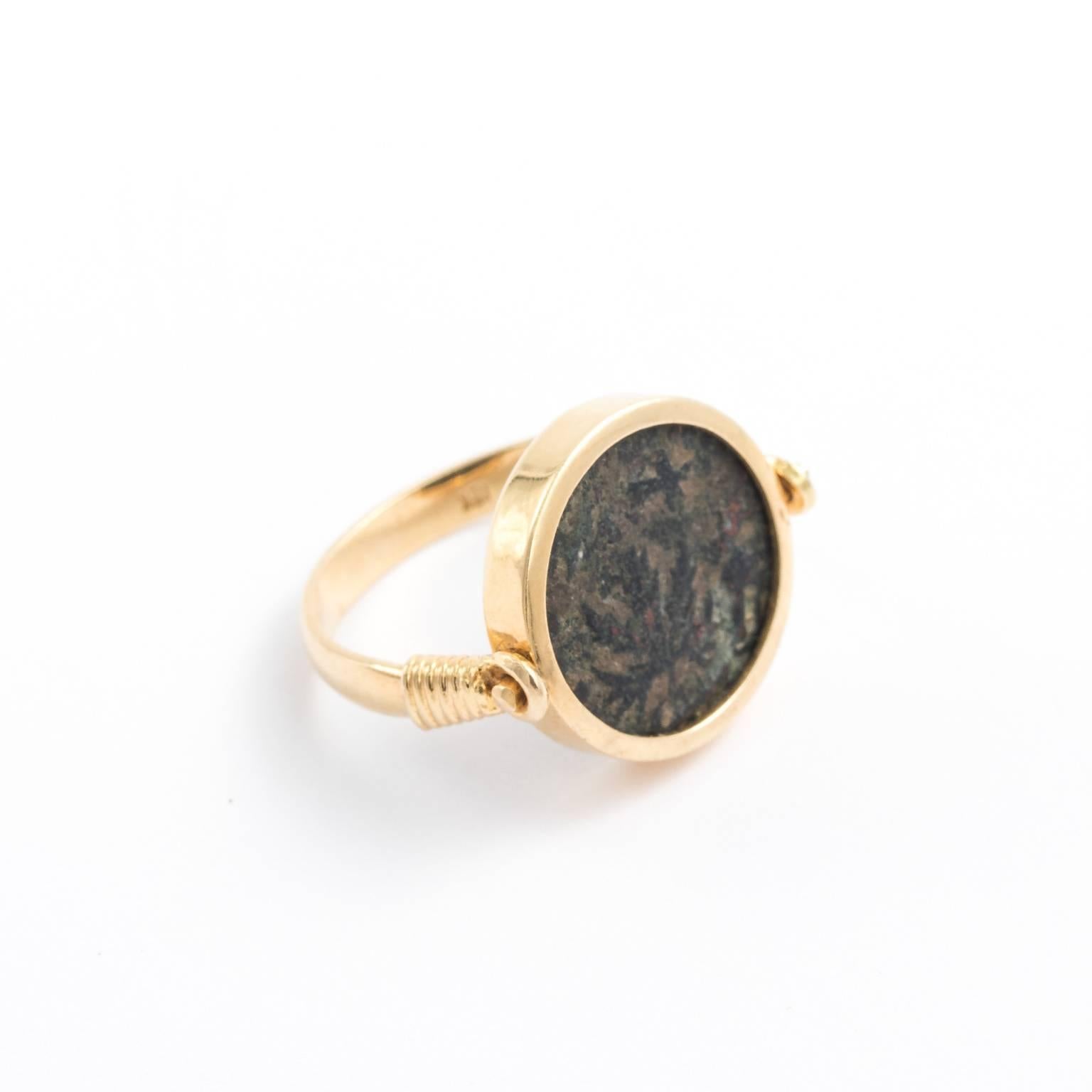Late Victorian coin ring that flips to show two different designs on an ancient Roman coin, set in 18kt gold. Commonly called 