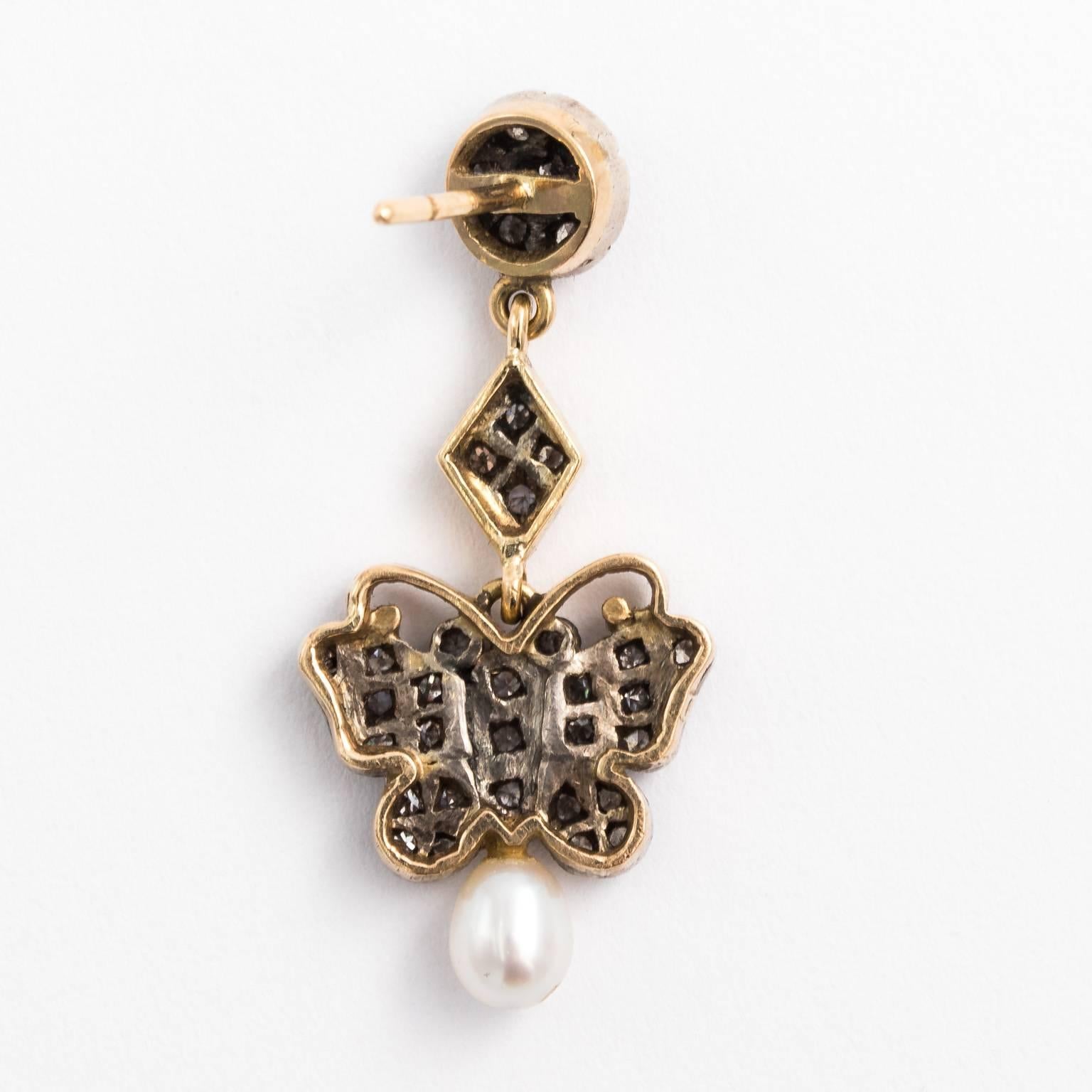 Circa early 20th century Art Nouveau diamond and pearl earrings.
