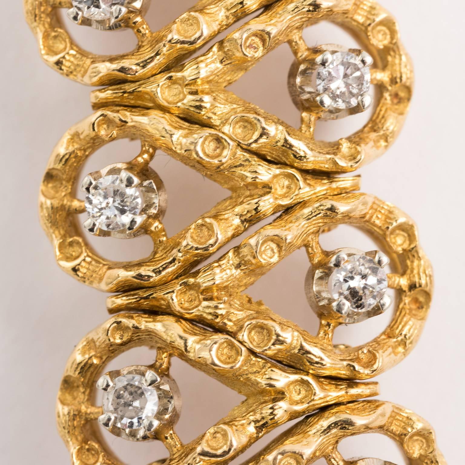 Circa 1960 18 karat gold and diamond bracelet.
