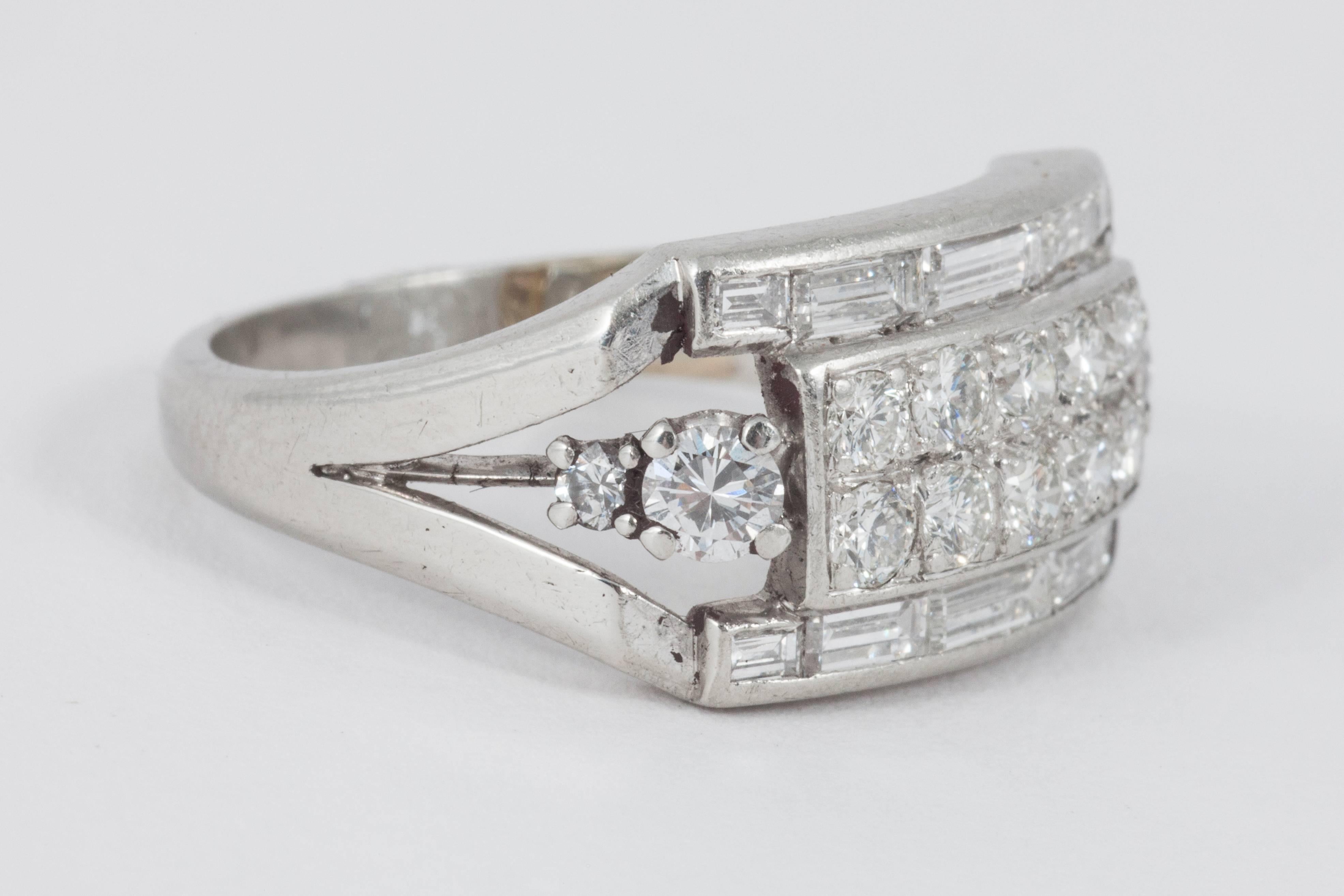 An art deco diamond dress ring set with old round brilliant diamonds, and baguette cut diamonds, set in platinum