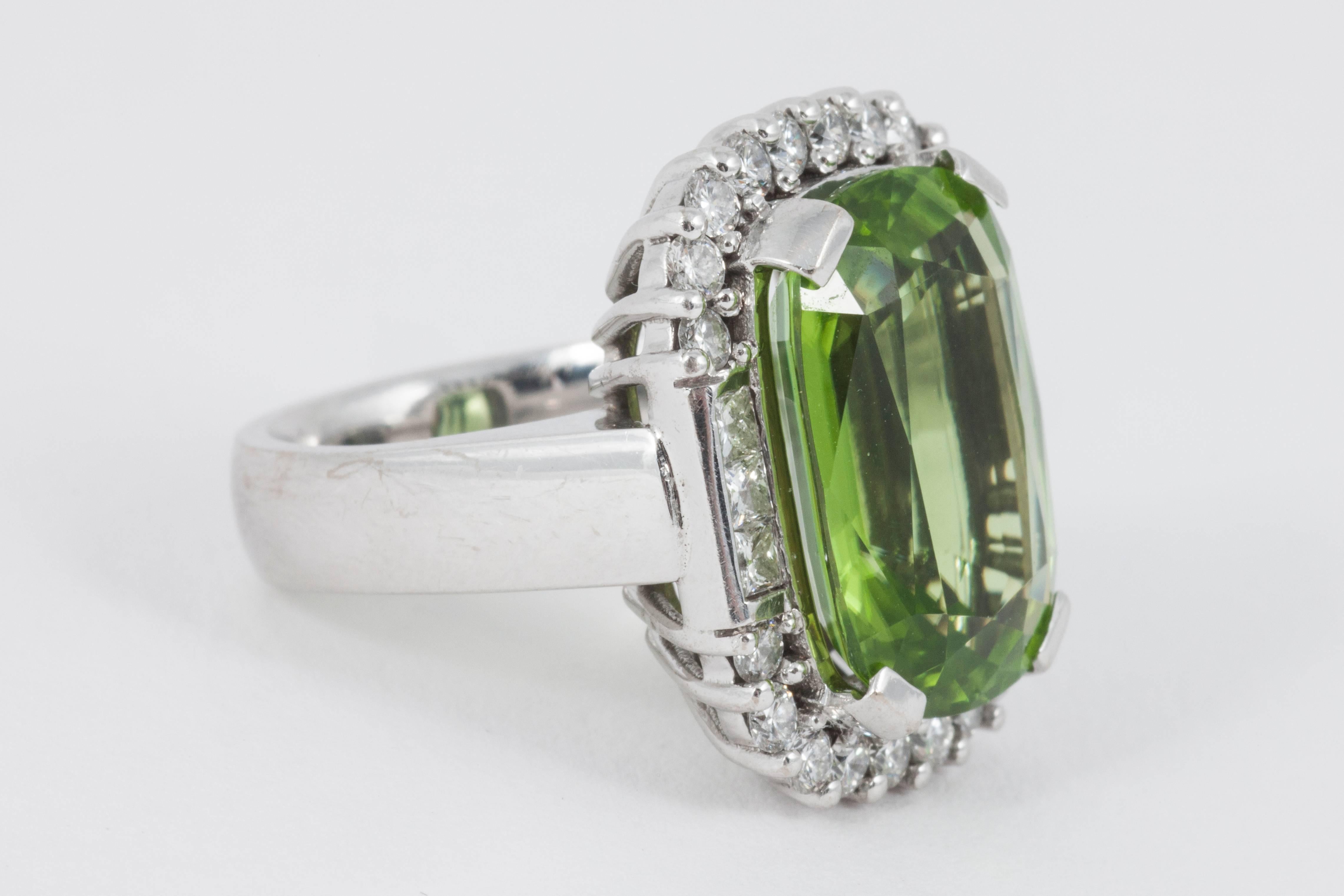 platinum set cushion-shaped peridot & diamond cluster ring, circa 1970’s